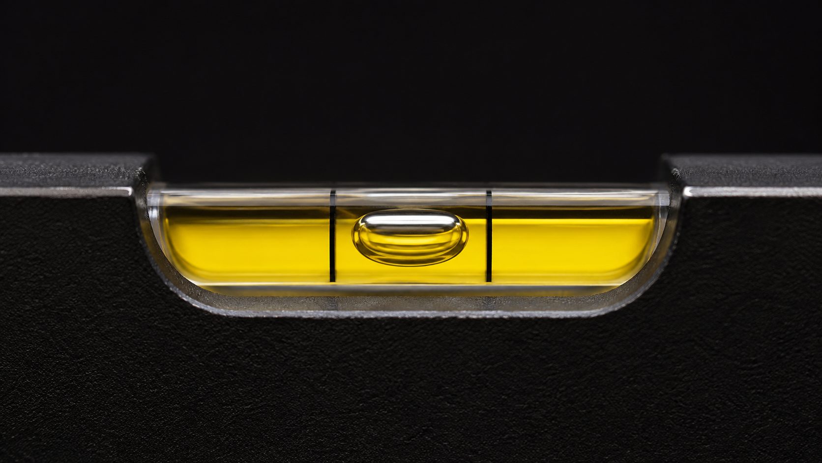 Spirit level detail — bubble centred, macro